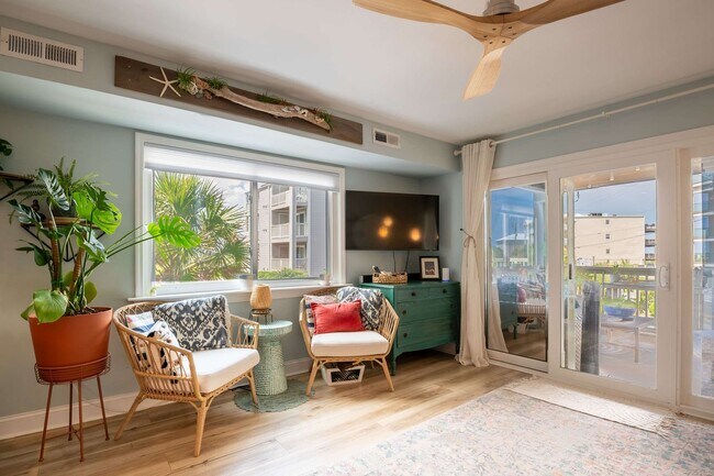 Building Photo - OFF-SEASON FURNISHED OASIS JUST STEPS FROM THE SAND