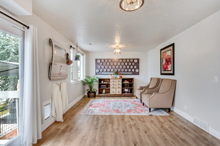 living room, entry from garage and access to backyard - 7063 S Swan Hill Dr