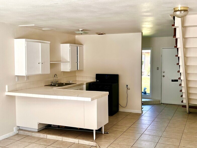 Kitchen view to front door Apt B - 619 W Provential Dr