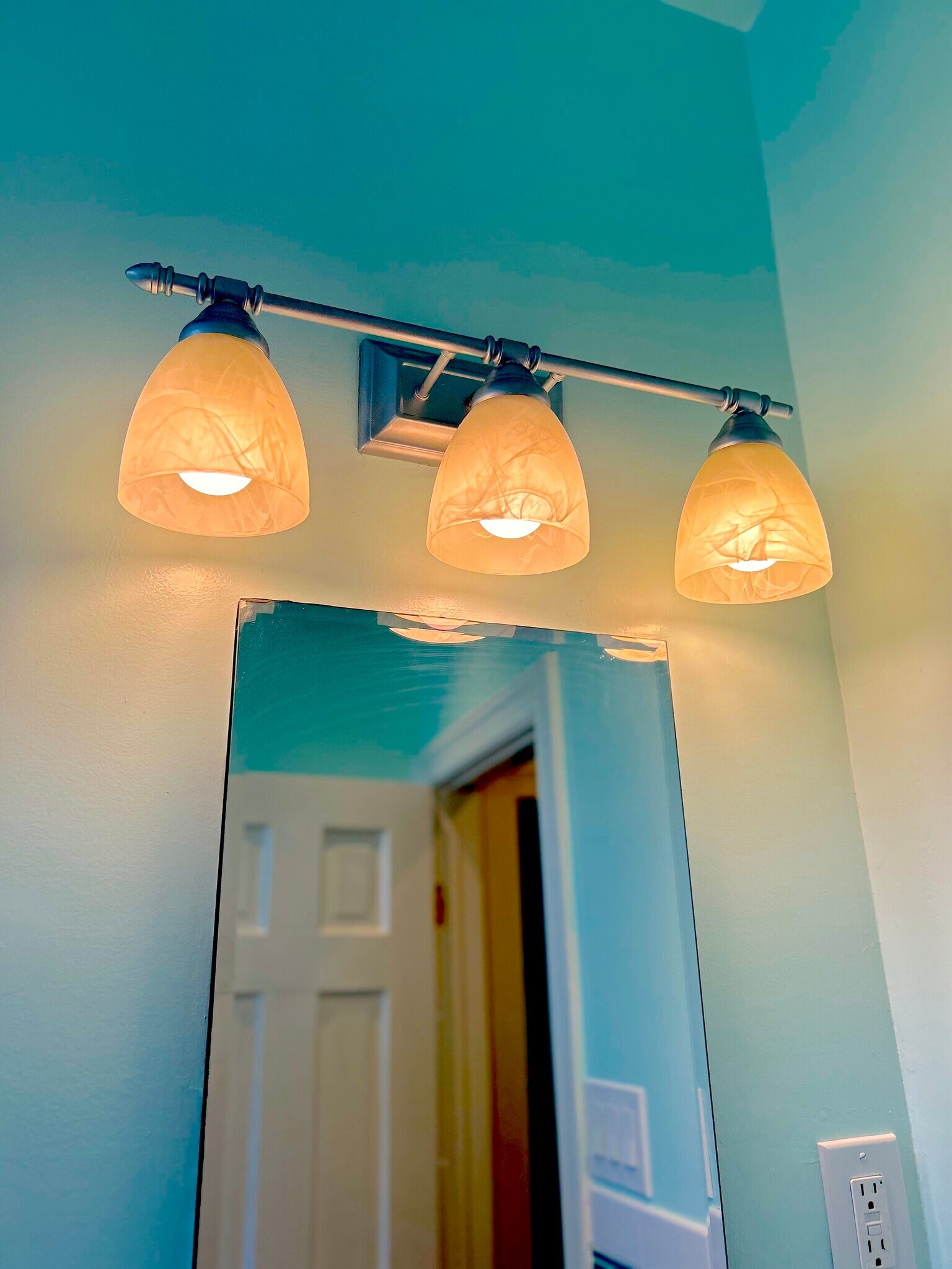 Bathroom lights over mirror - 301 M St NW