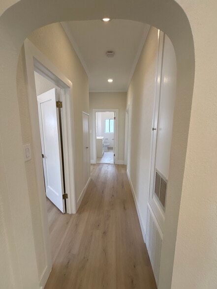 Hallway leading to bedrooms and bathroom. - 1062 S Shenandoah St