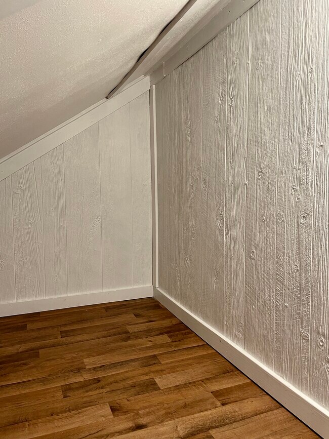 Newly finished clean and dry attic storage is 12’ wide. - 432 Webster St