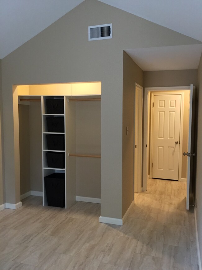 Master closet with built in shelving and bins for storage - 1103 Dulles Ave