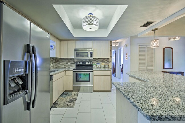 Fully Equipped Kitchen with Stainless Steel Appliances - 6181 39th Ave N