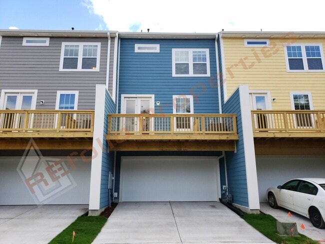 Building Photo - Beautiful Luxury 3 Story 3 Bedroom Townhome with 1st Floor Guest Suite, Attached 2 Car Garage, Co...