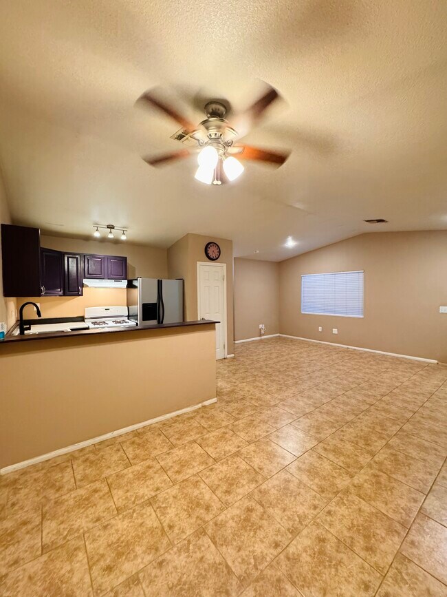 Kitchen, dining, and living room area - 7245 Murray Ln