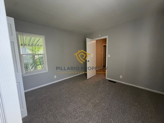 Building Photo - Charming 3-Bedroom Stone Bungalow with 2-Car Detached Garage & Fenced Yard, Available NOW!