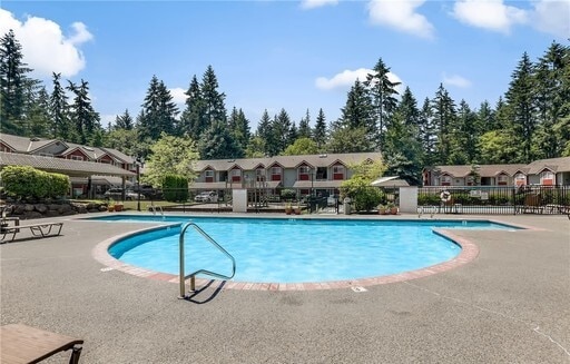 Building Photo - Lovely Condo in the Woods - Deck - Carport - FP - Closets - WD/DW - Fitness Center - Pools