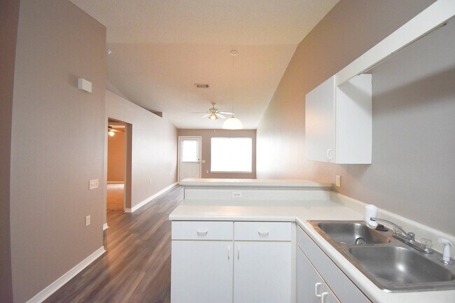 Building Photo - 2BR Patio Home with Open Layout, LVP Flooring, Private Fenced Yard, HOA Lawn Care & Convenient Bl...