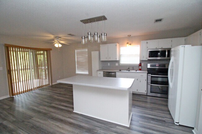 Building Photo - Live the Gulf Breeze Waterfront Life – Doc...