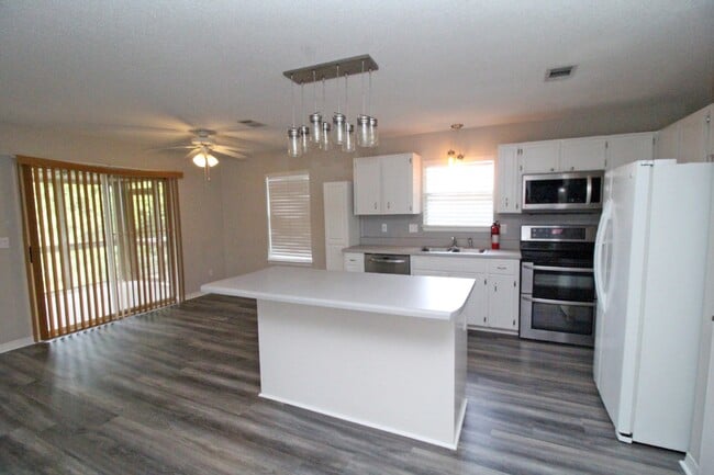 Building Photo - Live the Gulf Breeze Waterfront Life – Dock, Canal Access & Boat Lift!