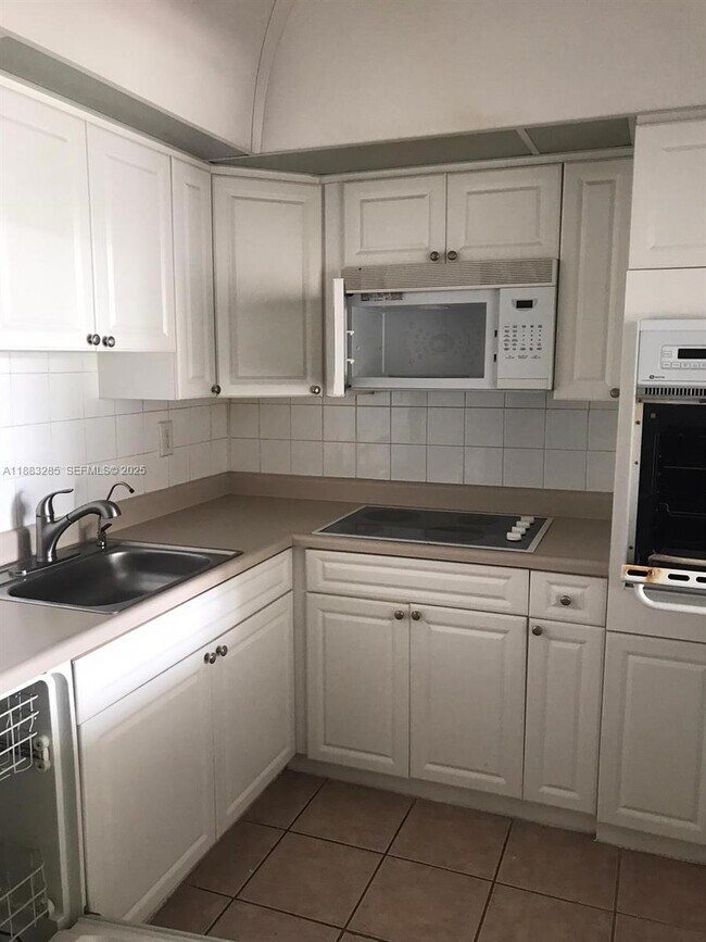 Building Photo - 19380 Collins Ave