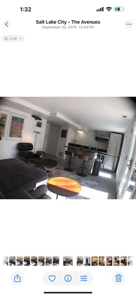 sofa and sitting area in open kitchen with sliding glass doors to patio - 524 E 6th Ave