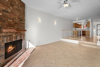 Building Photo - Light Filled Townhome Style Condo with Private Patios and Direct Access