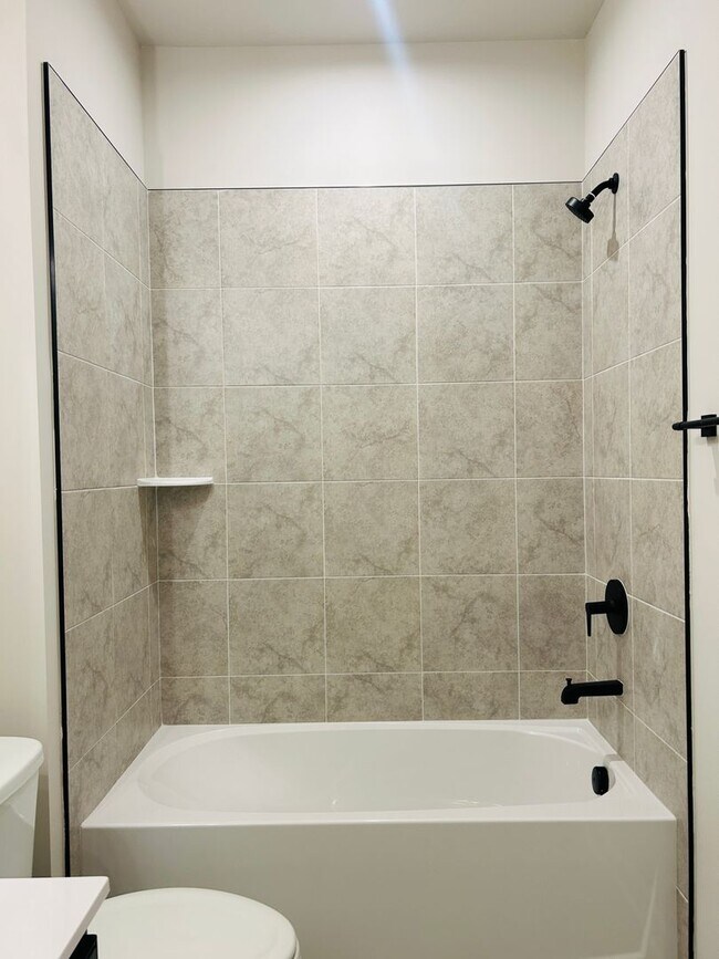 Building Photo - New Construction • 4 BR • 2 Full / 2 Half BA • End Unit Townhome in Village Town – Fayetteville’s...