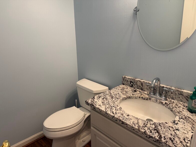 Main level updated half bath - 6419 Woodmont Rd