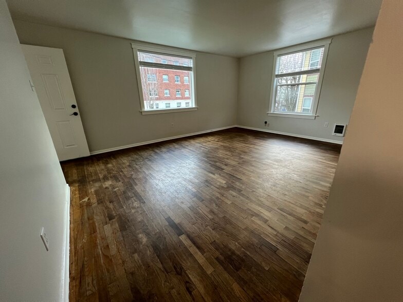 View of living room from hallway to bedroom and bathroom. - 620 6th Ave