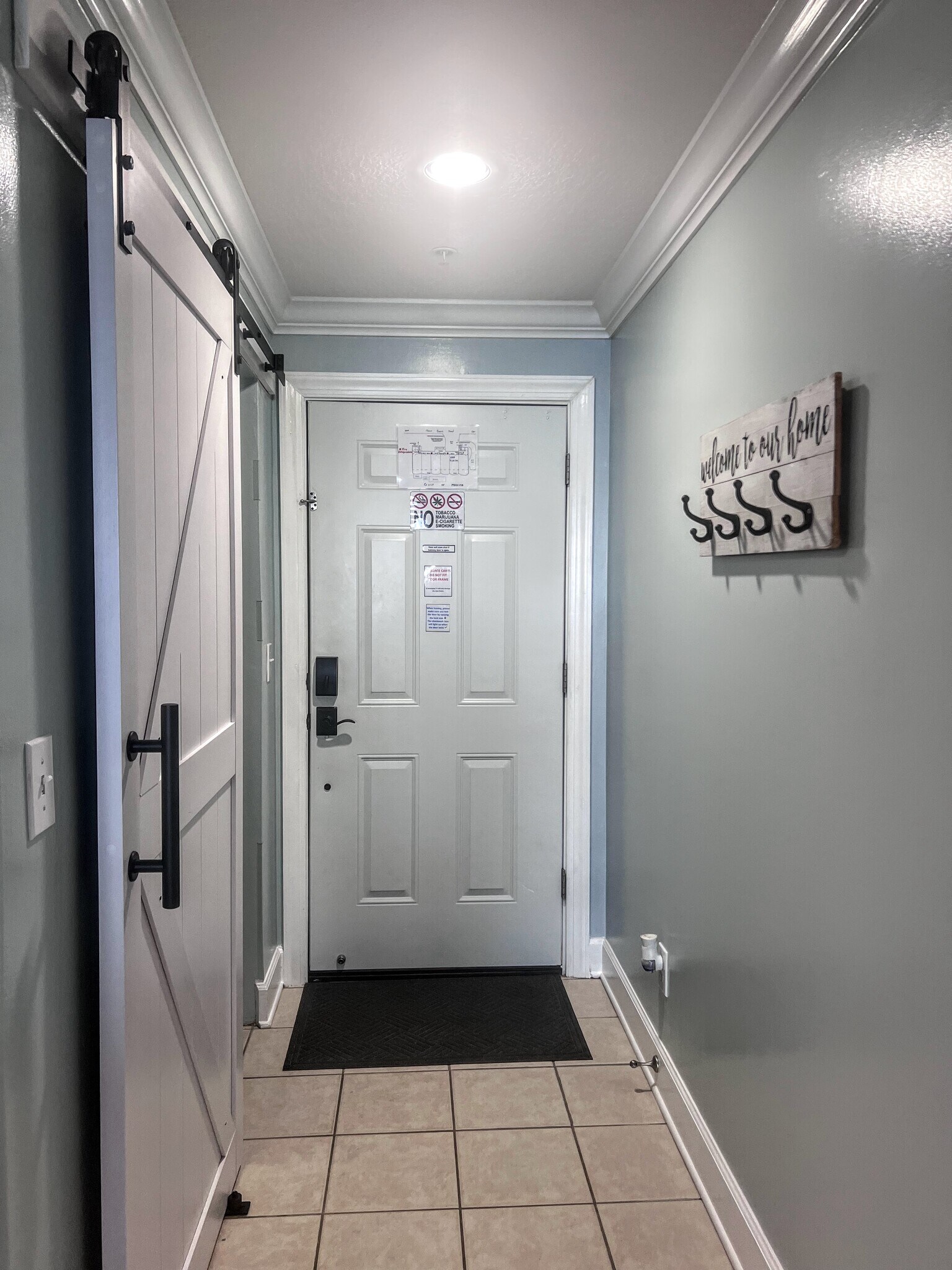 Entryway with a coat rack - 10625 Front Beach Rd