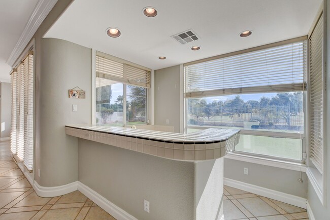 Building Photo - COMING SOON!! $1000 off 1st months Rent Guard-Gated Golf Course Living on the 14th Green!