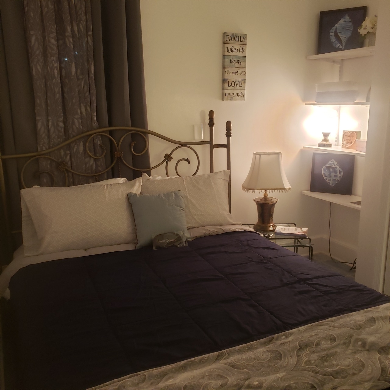 Cozy bedroom with queen size bed and wall mounted TV - 11 S 2nd St