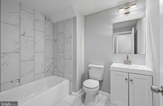 Building Photo - East District 3 BR/3.5 BA End Row Home w-Private Parking