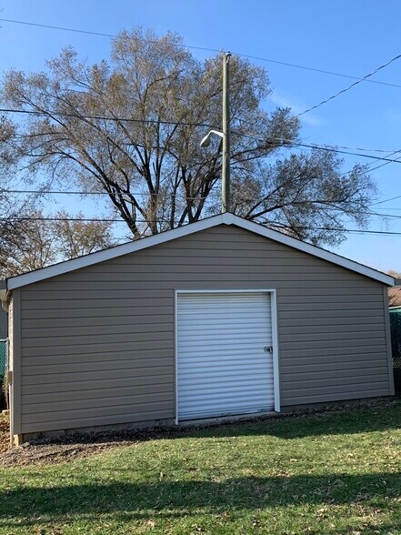 Detached garage with yard access (pictured) and garage door access from alley (not pictured) - 128 N 6th Ave