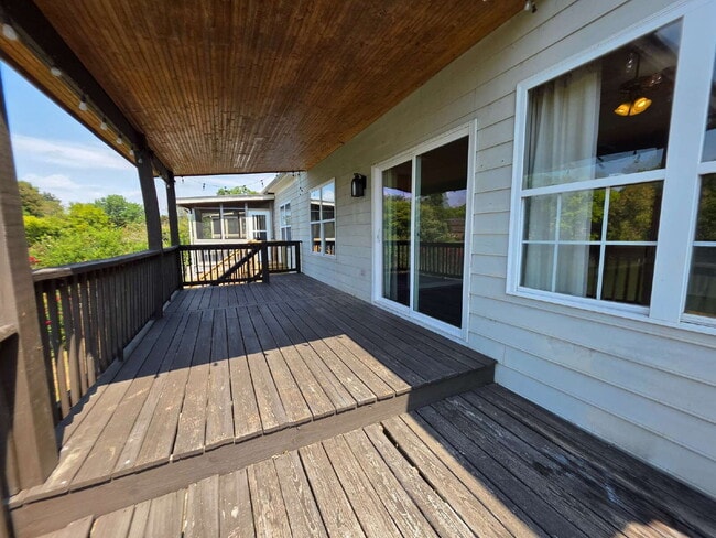 Building Photo - Lakefront 3BR/3BA with Covered Deck, Garage & Community Pool