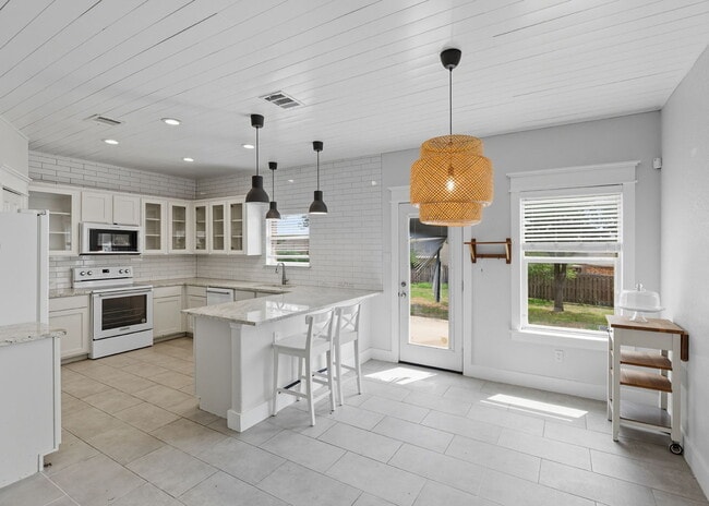 Building Photo - Discover the perfect blend of comfort and space at 6323 Myrtle.