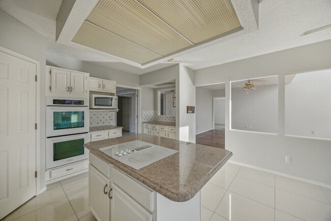 Building Photo - "Coming Soon! Spacious 4-Bedroom, 2.5-Bath Living Meets Storybook Backyard Charm!"