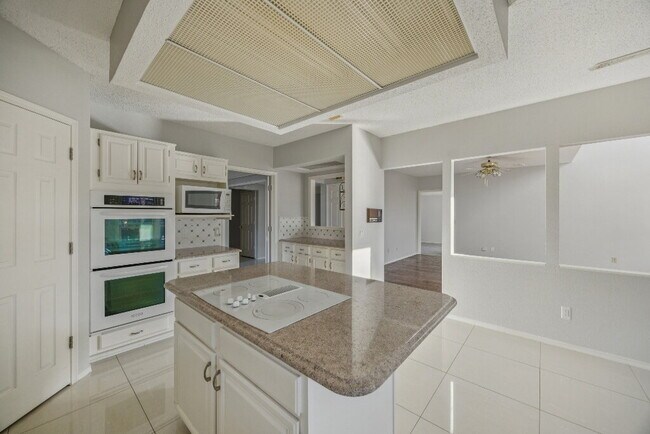 Building Photo - "Spacious 4-Bedroom, 2.5-Bath Living Meets Storybook Backyard Charm!"