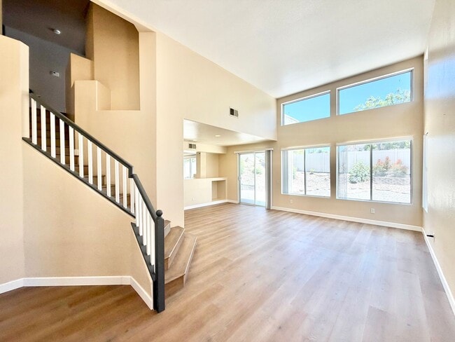 Building Photo - Spacious 5 Bedroom Home with 3 Car Garage & Primary Suite Balcony