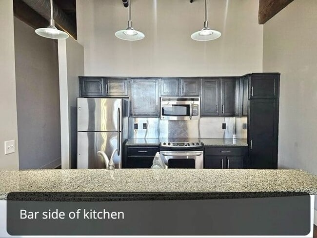 Building Photo - Modern Condo on Front St. with River views...