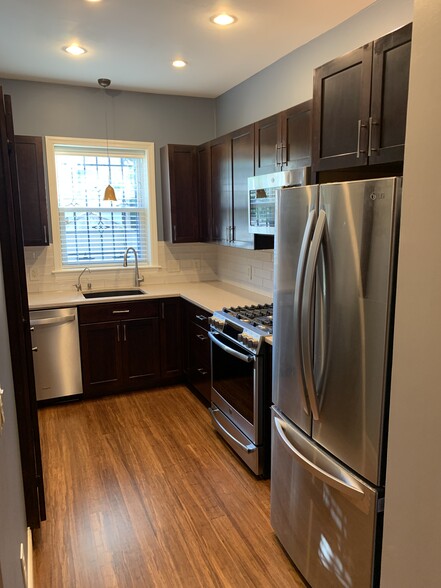 Updated kitchen with stainless appliances. - 2241 12th Plz NW