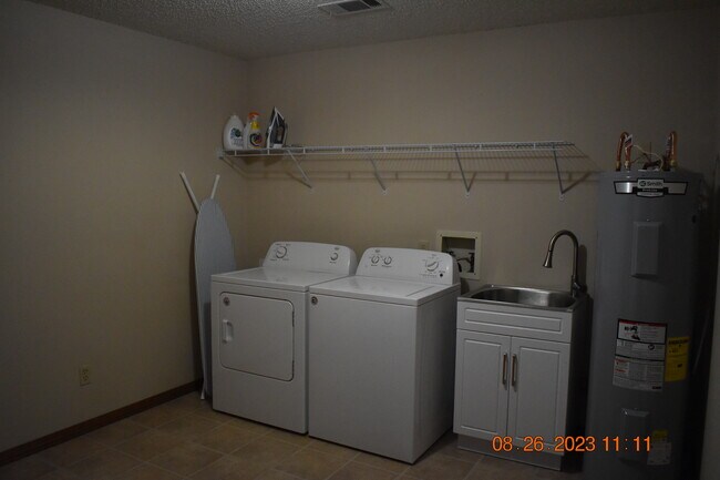 Laundry room utility sink - 3126 Station Ct