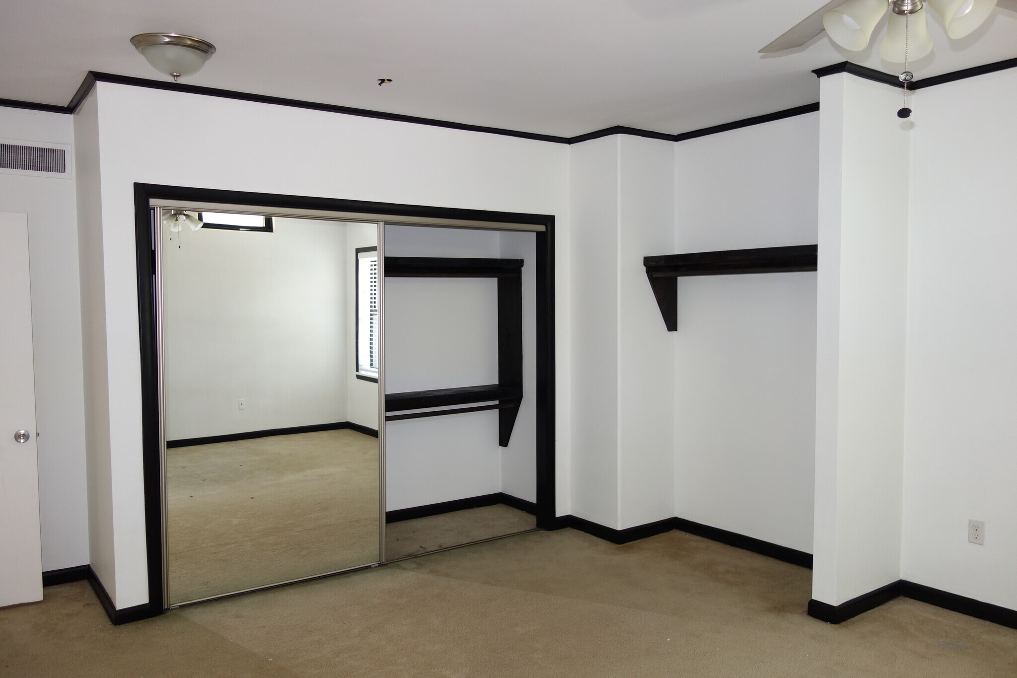 Primary Bedroom View, mirrored sliding closet doors - 1745 S Birmingham Ave