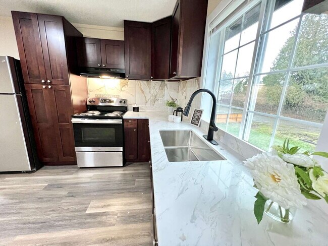 Building Photo - Elevated 3-Bedroom Home with Secure Garage & Cozy Living Space