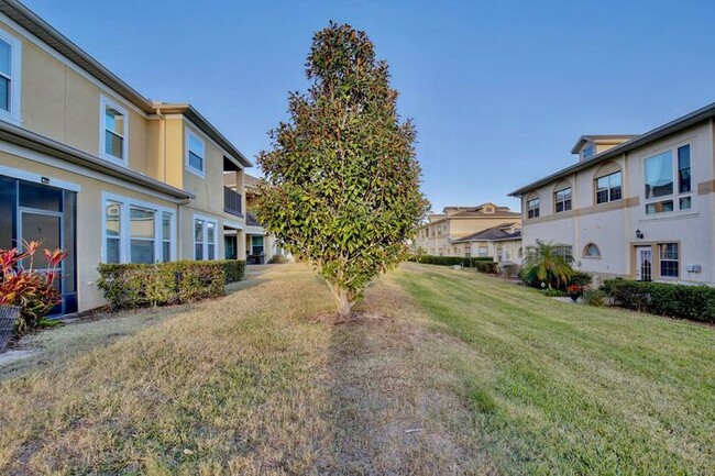 Building Photo - Gorgeous 4/2.5 Spacious Townhome with a Loft Area and a 2 Car Garage in the Desirable Gated Commu...