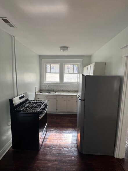 Kitchen with brand new Whirlpool range and refrigerator - 1333 Castlewood Ave