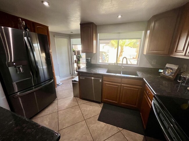 Kitchen with stainless steel appliances - 9440 N 52nd Ln