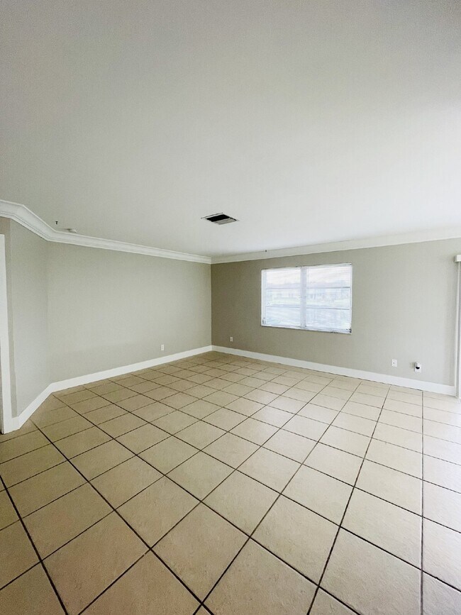Building Photo - Updated 2-bedroom waterfront duplex with walk-in closets, enclosed Florida room, and canal views ...