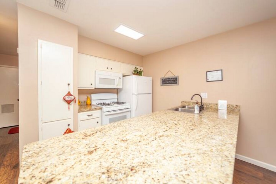 Granite countertops with new appliances - 303 Babcock Rd