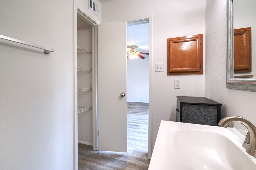 Primary Bathroom, in an en-suite design with the primary bedroom, with its private storage area visi - 2025 Augusta Dr