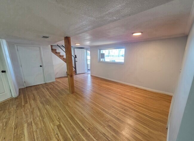 Downstairs Daylight Basement with picture window and - 1409 2nd West Hill Dr