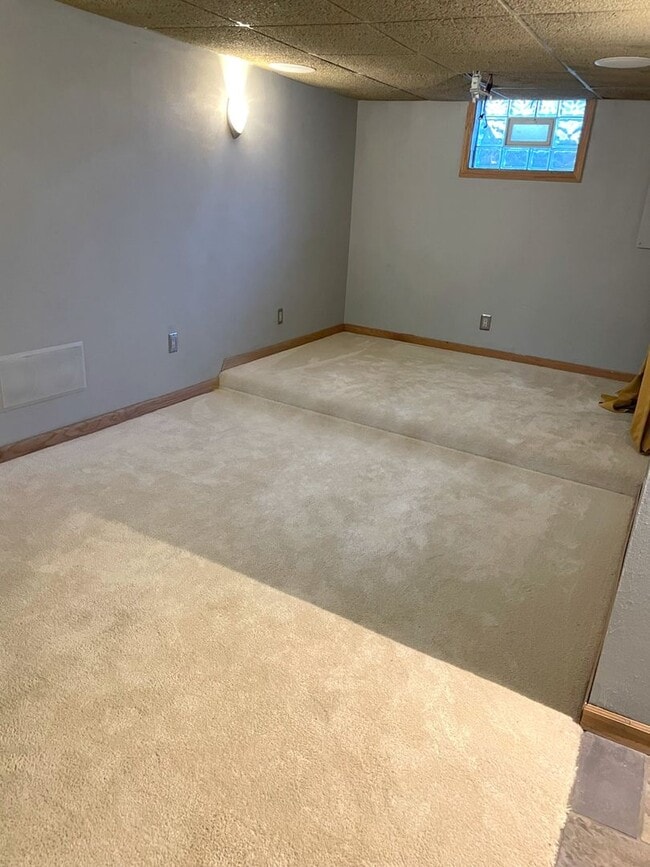 Building Photo - Spacious 3-Bedroom with Finished Basement | Parking, Laundry, & Private Backyard