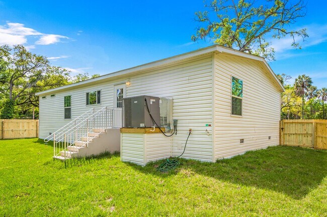Building Photo - Experience exceptional living at its finest