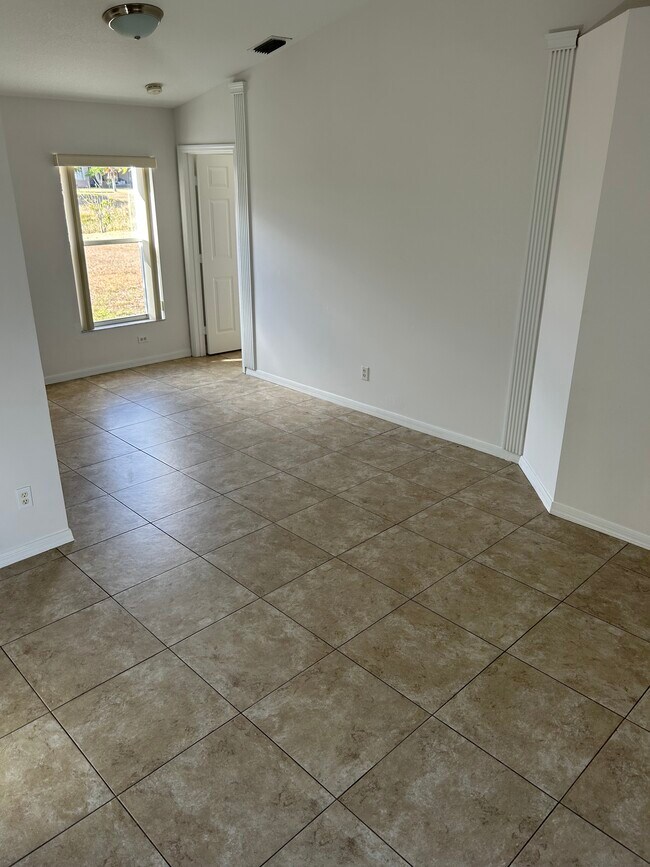 Building Photo - 6480 NW Volucia Dr