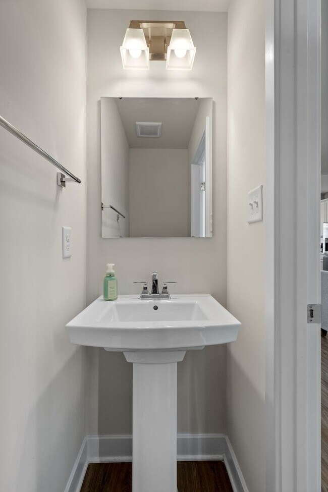 Building Photo - Luxurious three-story townhome with owner's suite and high-end finishes
