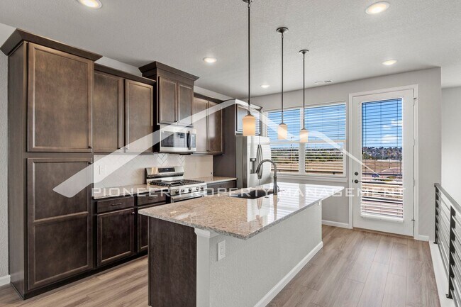 Building Photo - Contemporary Townhome in the Vibrant Interquest Low Maintenance Community with 2 car garage, Wash...