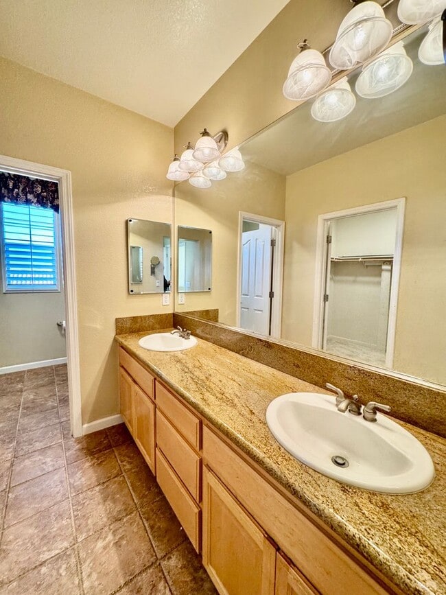 Building Photo - Located in a peaceful and well-maintained senior community, this spacious 3-bedroom, 3.5-bath Plu...