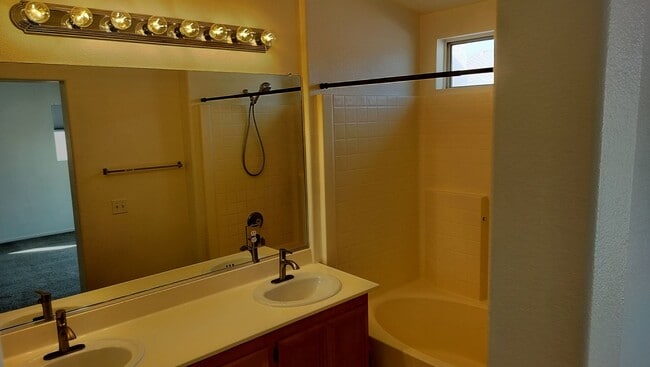 Building Photo - Townhome with Loft + Two Bedrooms/Baths - Designed for Comfort in Gated Community